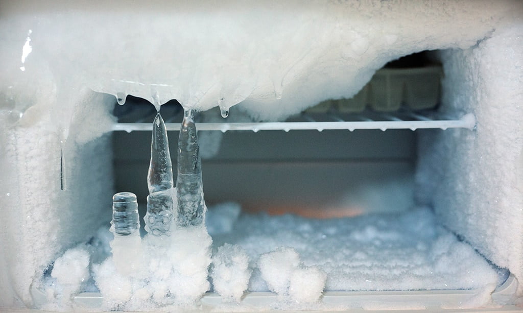 What is the cause of frost on the refrigerator